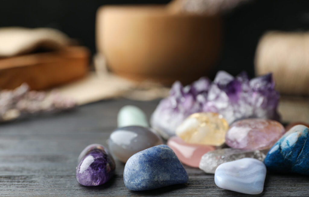 Colorful healing gemstones on a wooden table